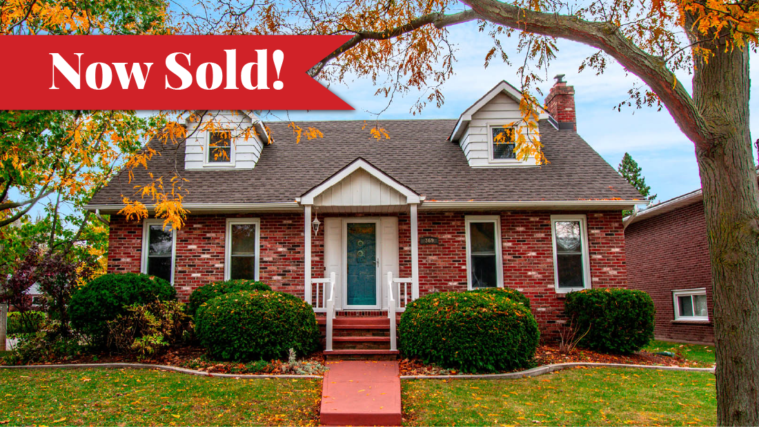 Now Sold banner on brick cape cod style home in Port Colborne listed with Frank Ruzycki RE/MAX Real Estate