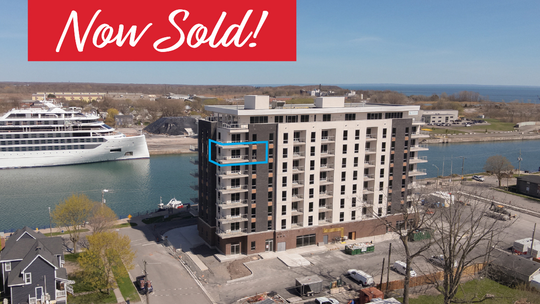 now sold banner with canalfront condo flag on 705-118 west st port colborne sold by frank ruzycki real estate