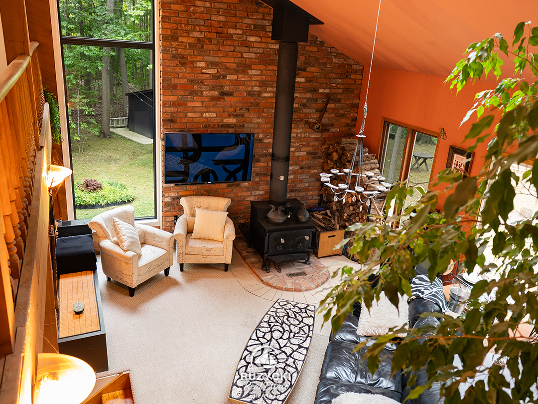 view of living room from loft bedroom above at 4121 fox rd stevensville