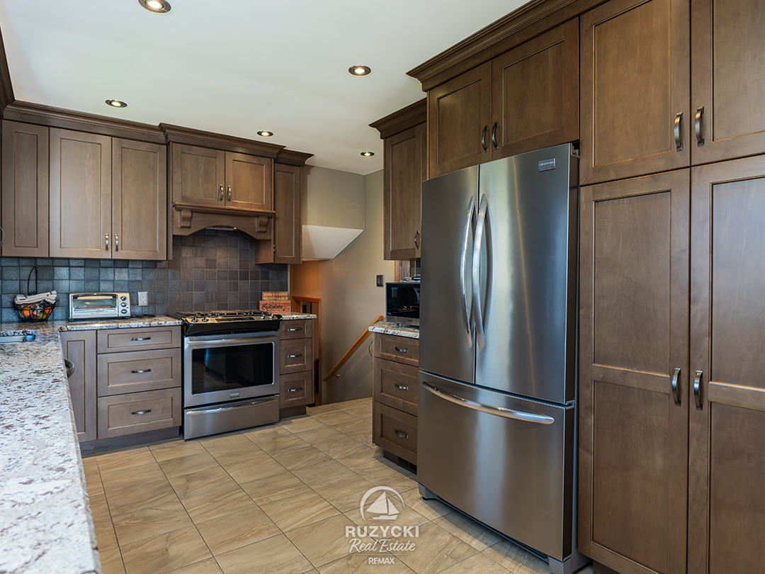 82-scholfield-ave-port-colborne_18 Built-in Stainless steel fridge in updated kitchen at 82 Scholfield Ave in Port Colborne