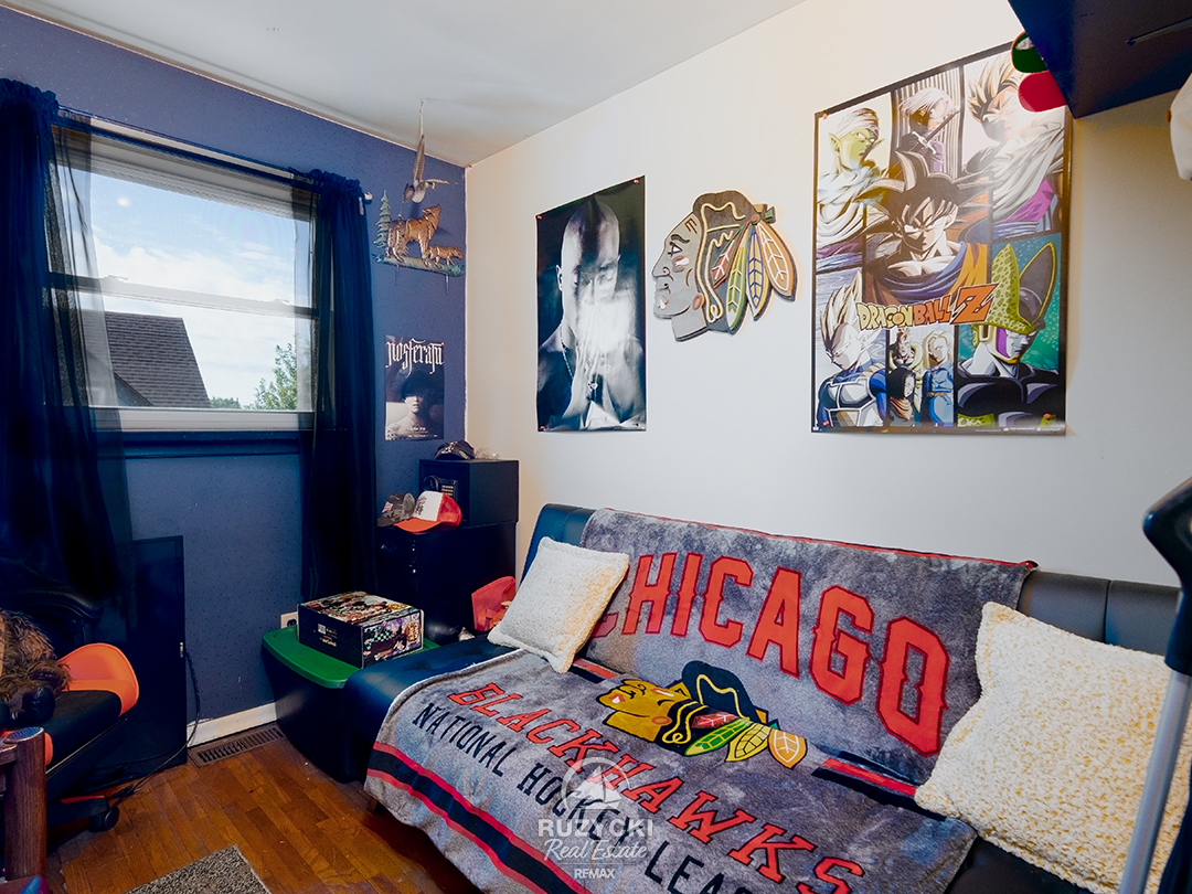 137-wellington-street-port-colborne_21 bedroom with futon & chicago blackhawks memorabilia