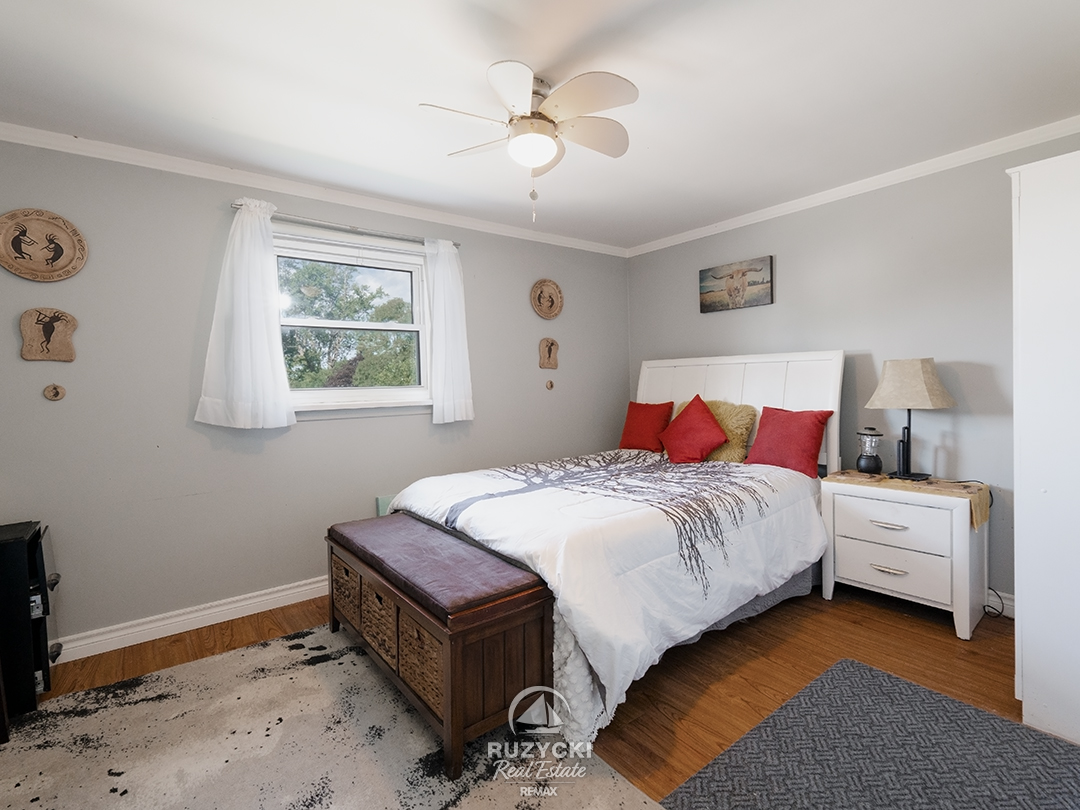 137-wellington-street-port-colborne_56 bright bedroom with double bed