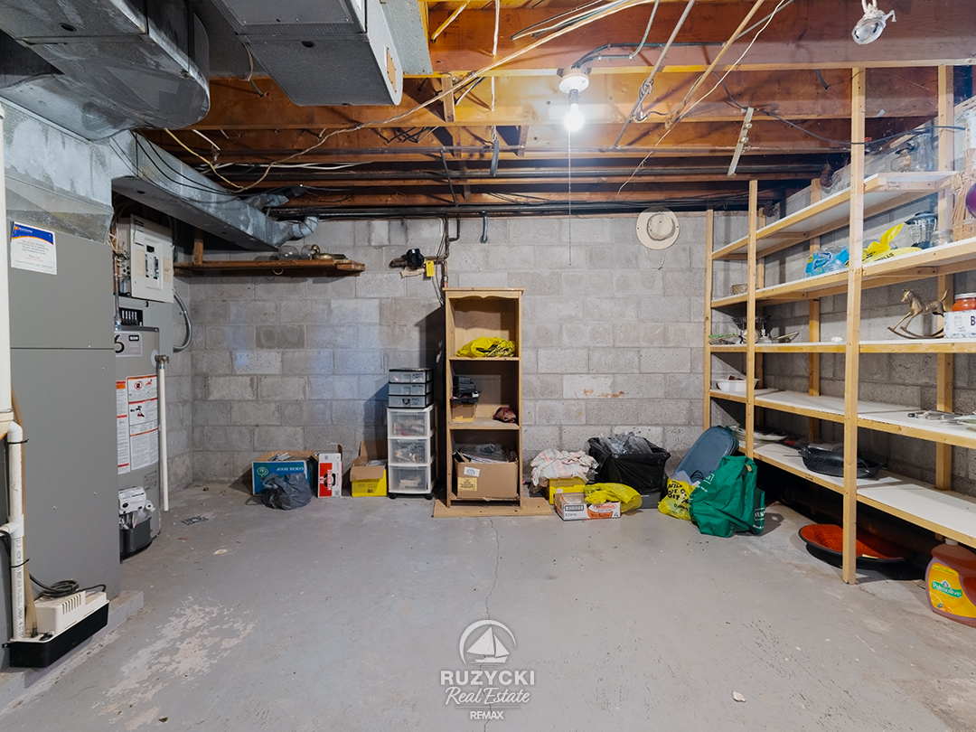 137-wellington-street-port-colborne_57 unfinshed basement with shelves