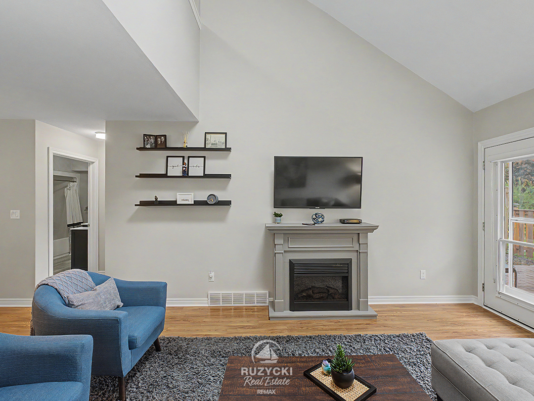 319-elgin-street-port-colborne_39 open concept living room with fireplace and access to rear patio