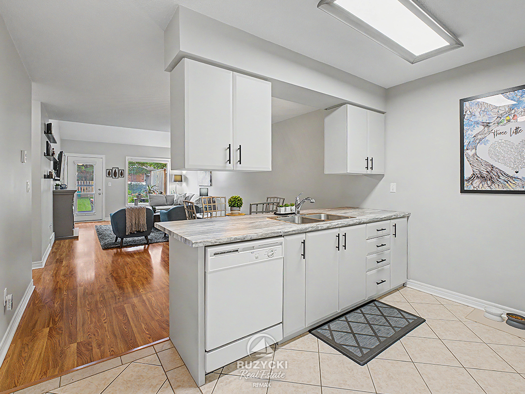 319-elgin-street-port-colborne_45 kitchen with white cabinetry and appliances
