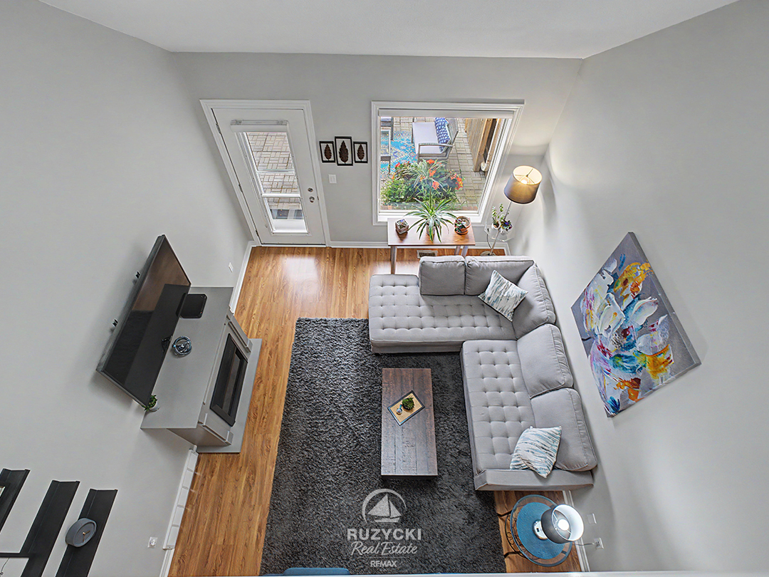 319-elgin-street-port-colborne_58 overhead view of open concept living room from loft primary bedroom