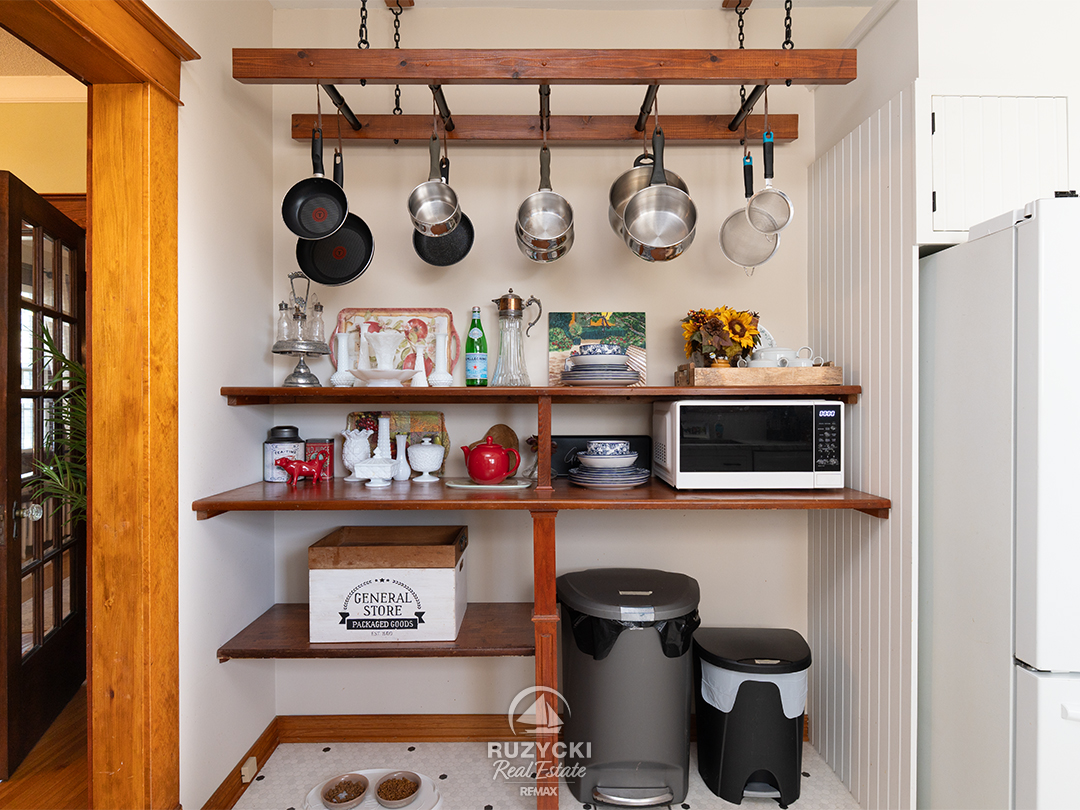 344-clarence-street-port-colborne_01 storage area with pot rack in kitchen