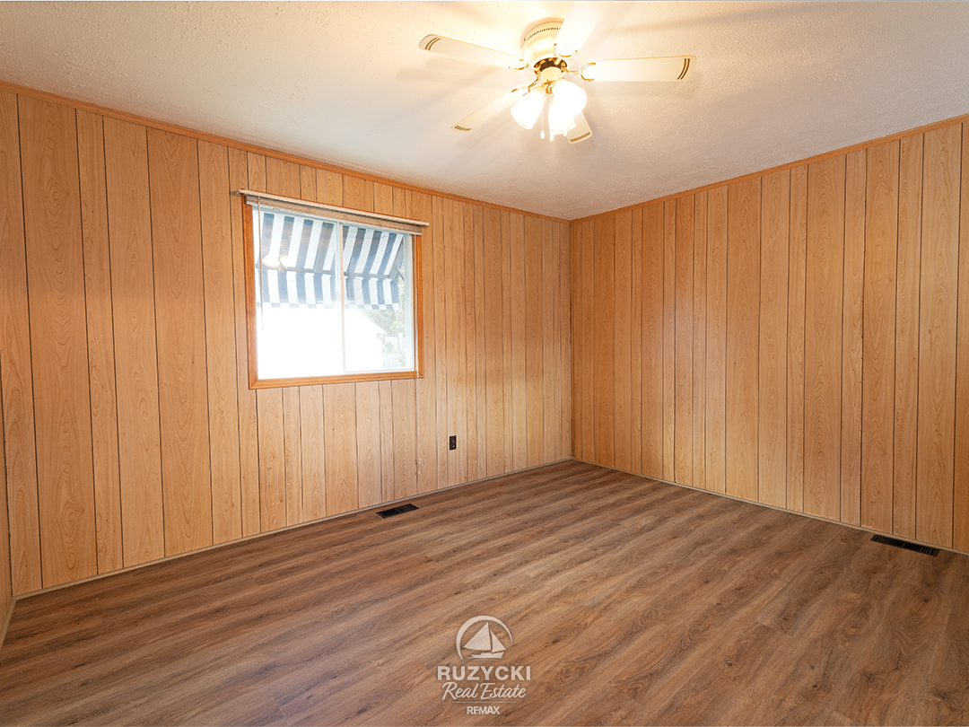 632-king-street-port-colborne_38 wood panelled bedroom in apartment unit