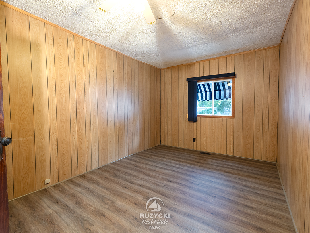 632-king-street-port-colborne_42 wood panelled bedroom in apartment unit