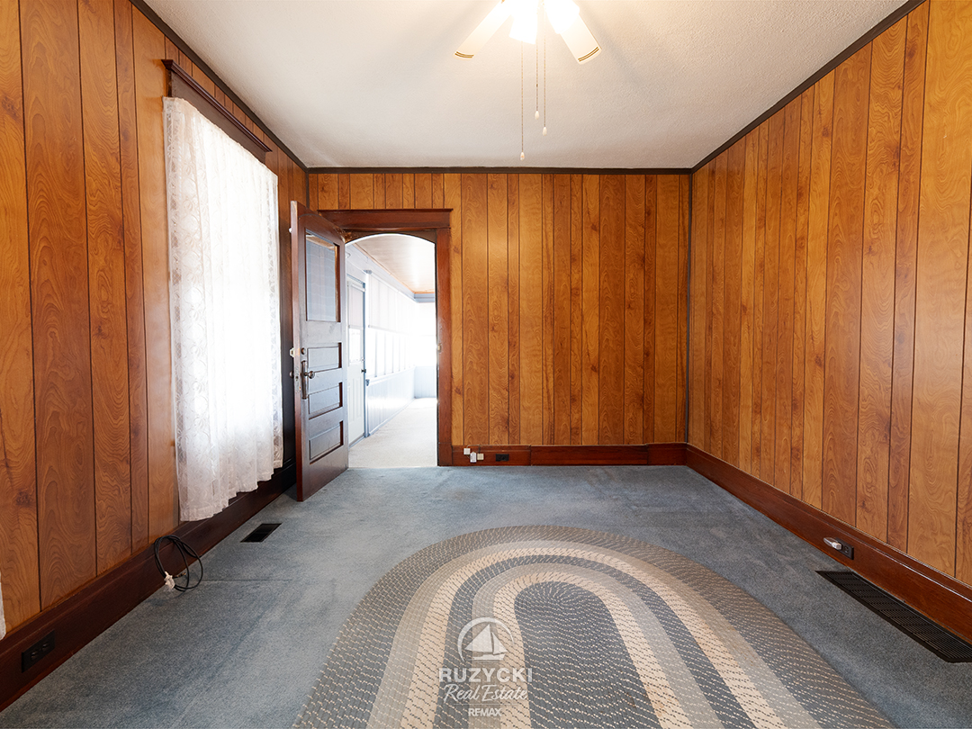 632-king-street-port-colborne_45 wood panelled living room in apartment unit