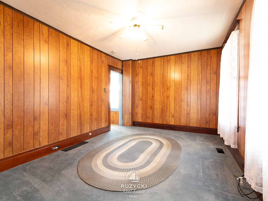 632-king-street-port-colborne_46 wood panelled living room in apartment unit