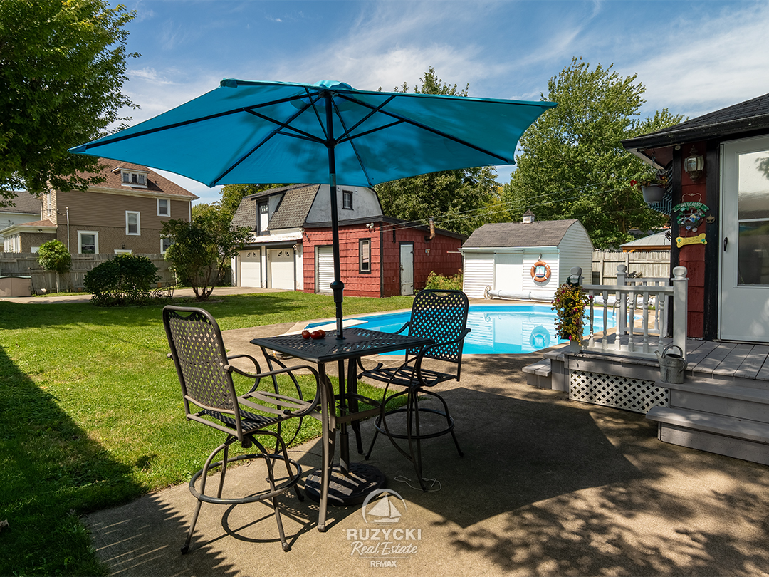 632-king-street-port-colborne_48 fenced backyard with double garage and inground pool