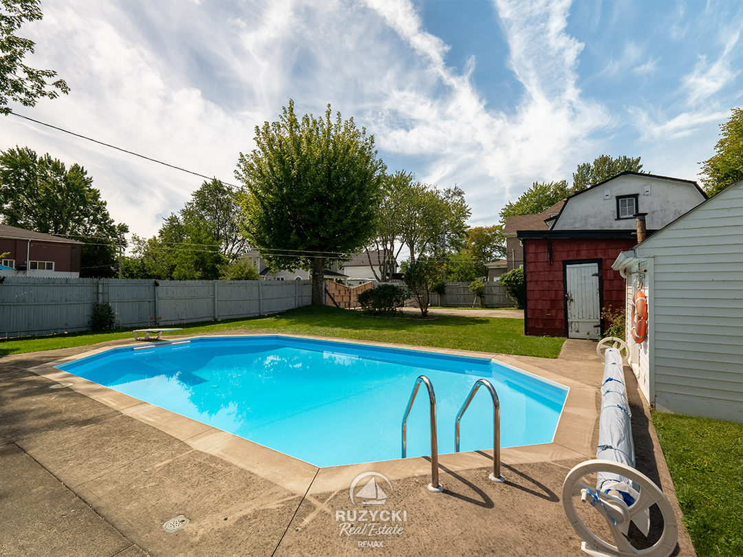 632-king-street-port-colborne_67 inground pool in fenced backyard with shed
